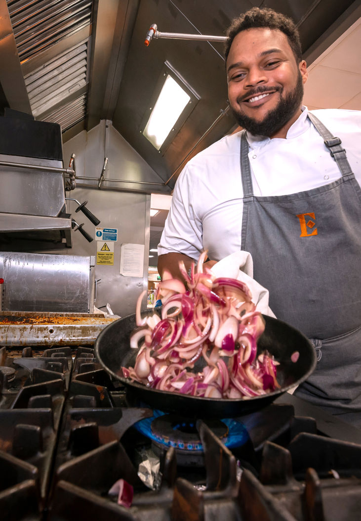 a chef prepping food as part of food services