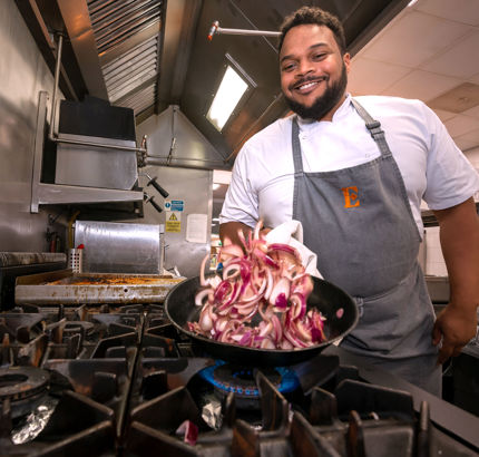 a chef prepping food as part of food services