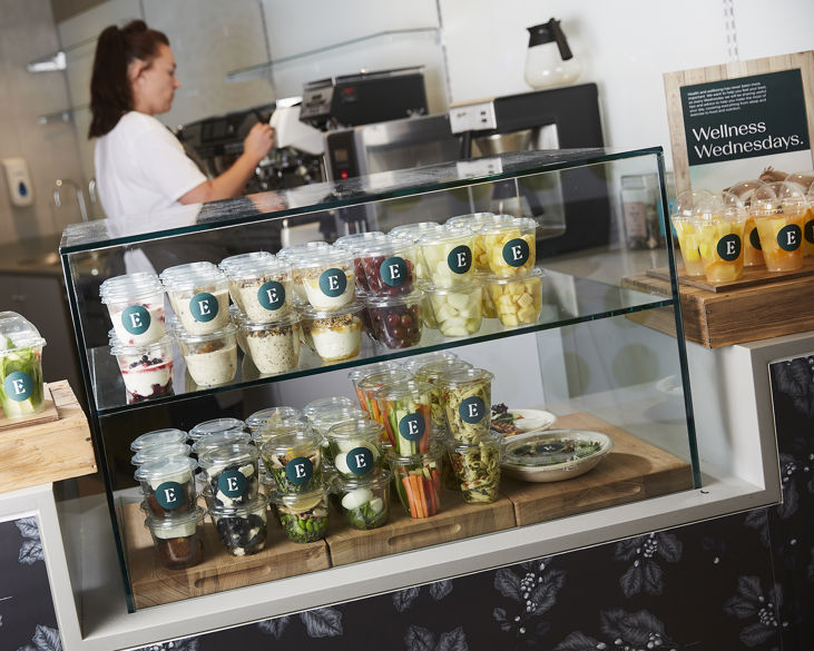 a barista making a coffee as part of micromarket solutions for businesses