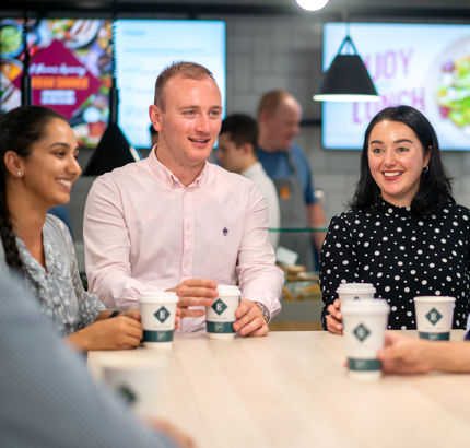 employees enjoying coffee served by contract caterers