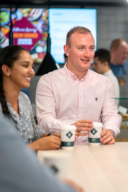 employees enjoying coffee served by contract caterers