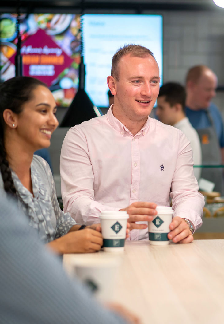employees enjoying coffee served by contract caterers
